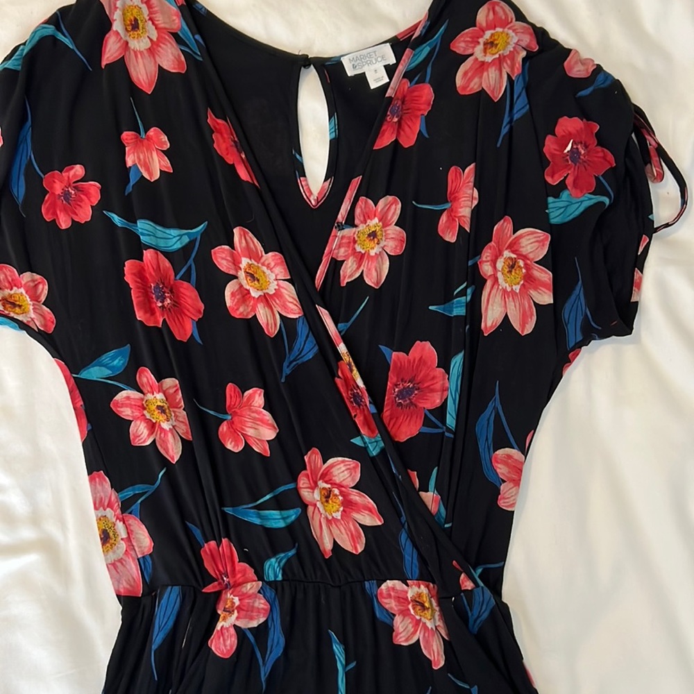 Black floral romper. There are pockets! There is a hidden button near the bust.